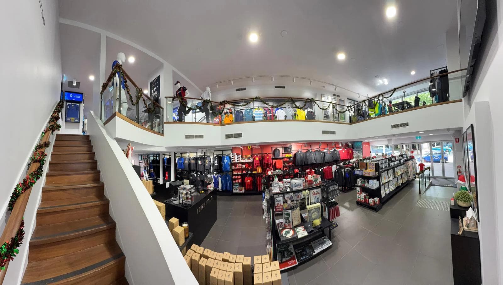 Two-level sports merchandise store interior with jerseys and displays