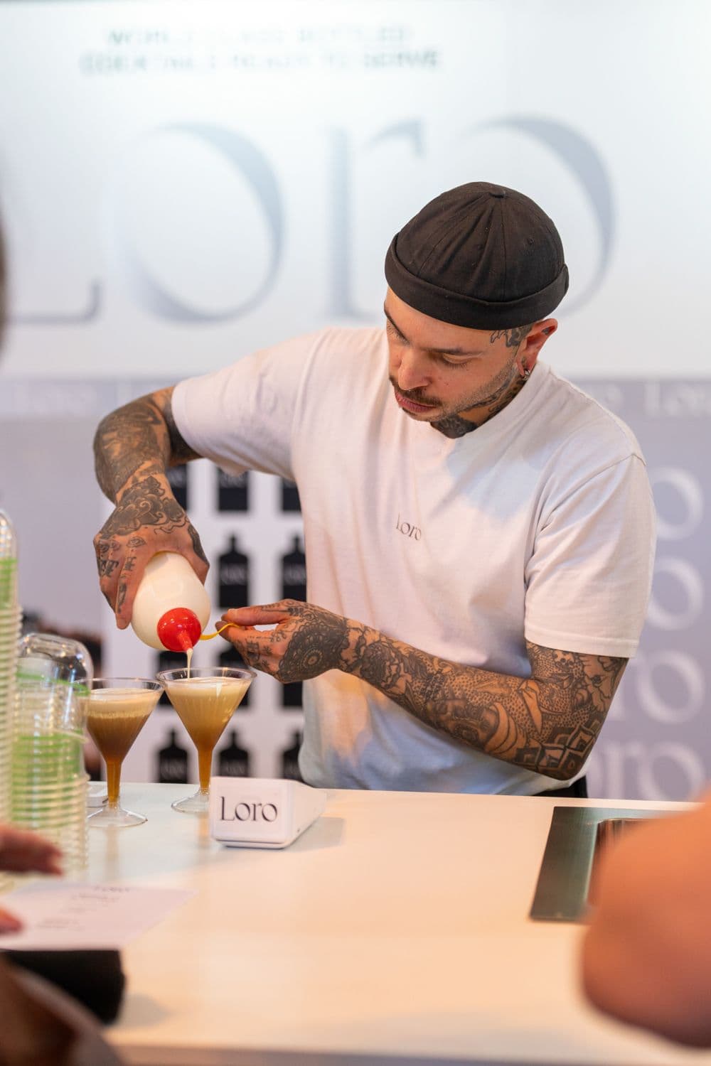Tattooed bartender preparing cocktail at Loro bar during Melbourne Italian Festa