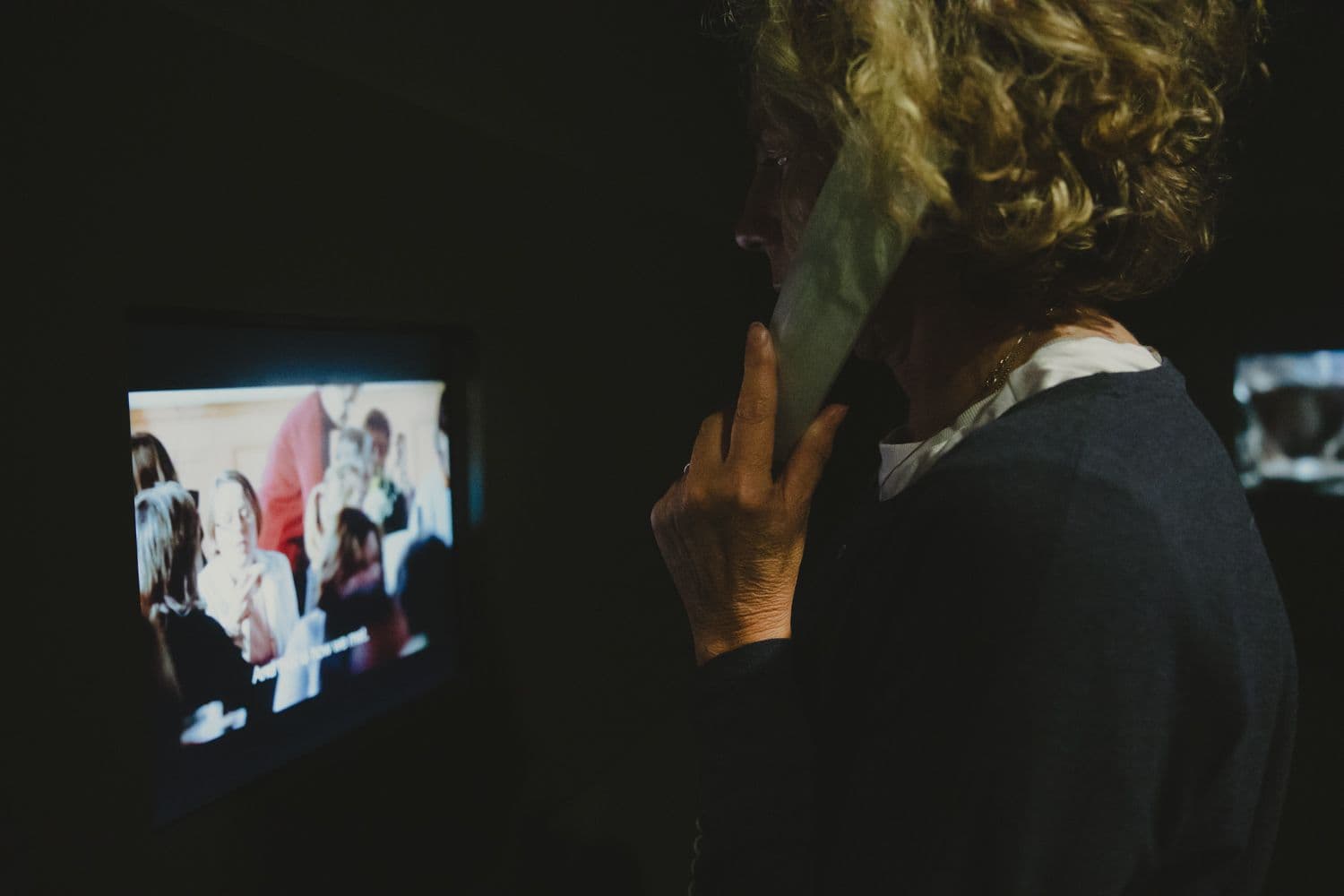 Person capturing a live performance on a smartphone