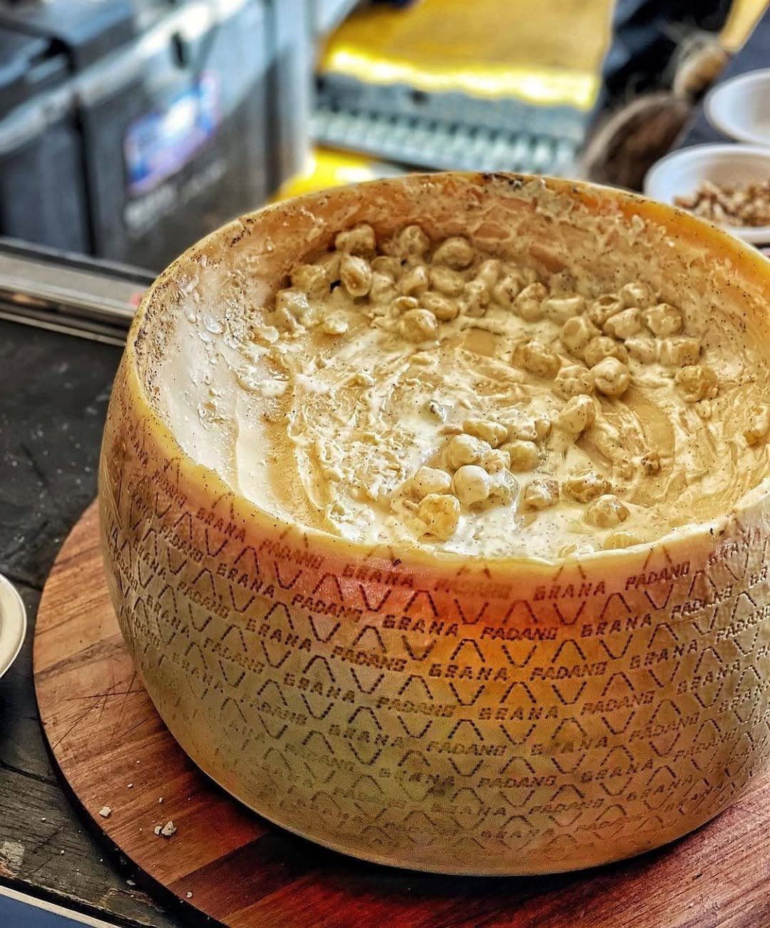 Pasta tossed in a parmigiano wheel
