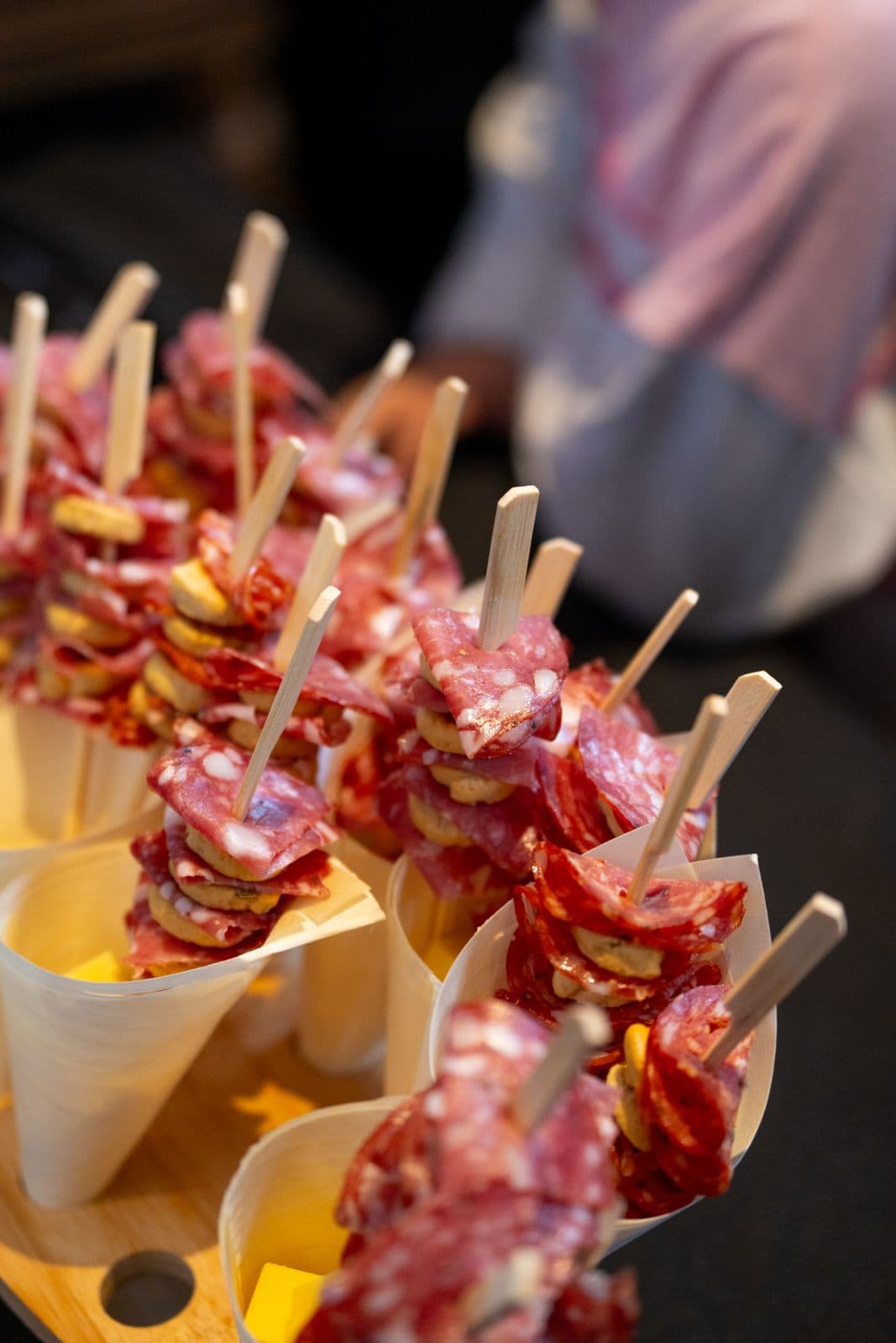 Cured salami and cheese skewers on wooden picks with sauce cups at Melbourne Italian Festa