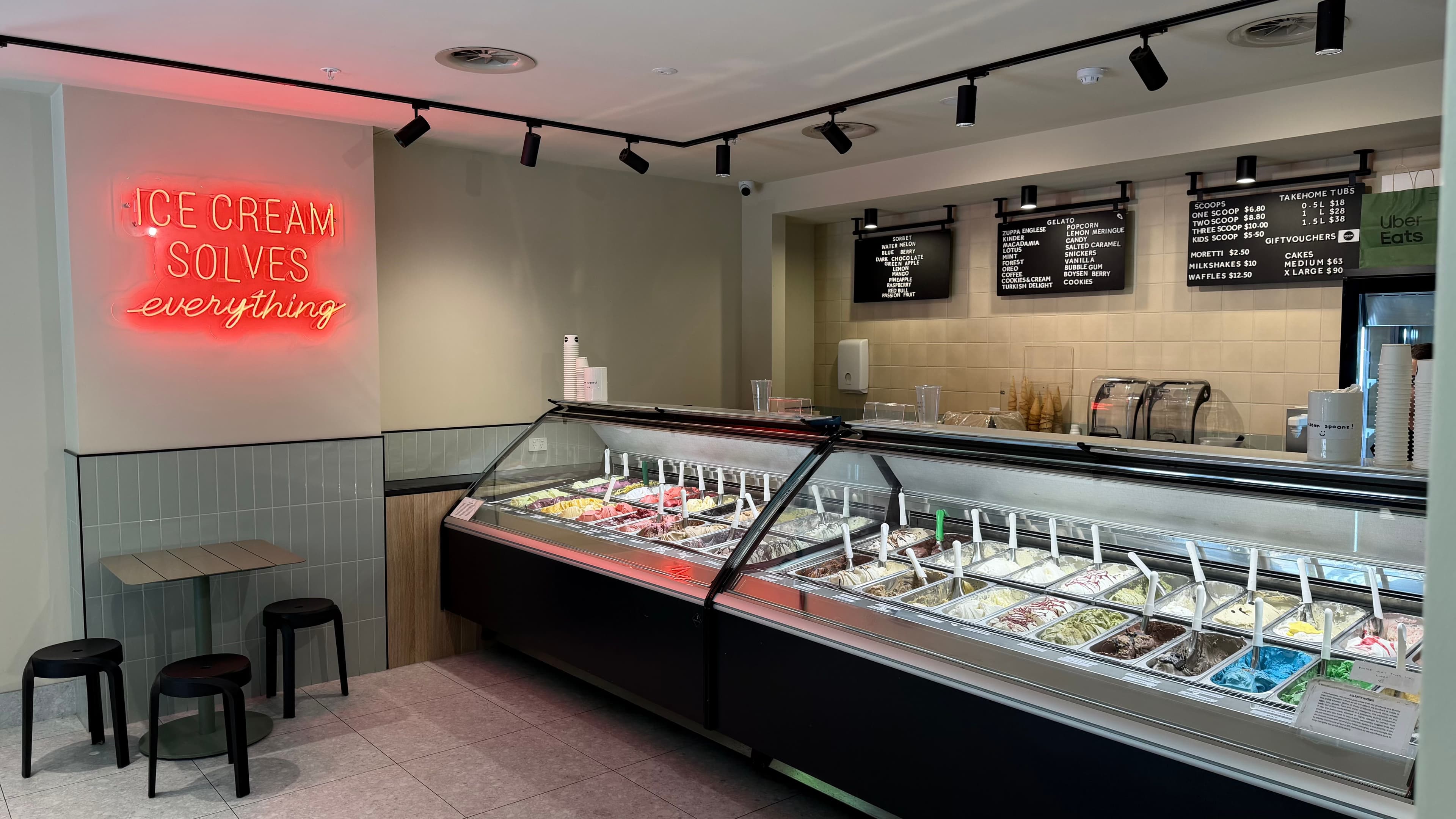 Gelato display case with colourful flavours inside a bright shop