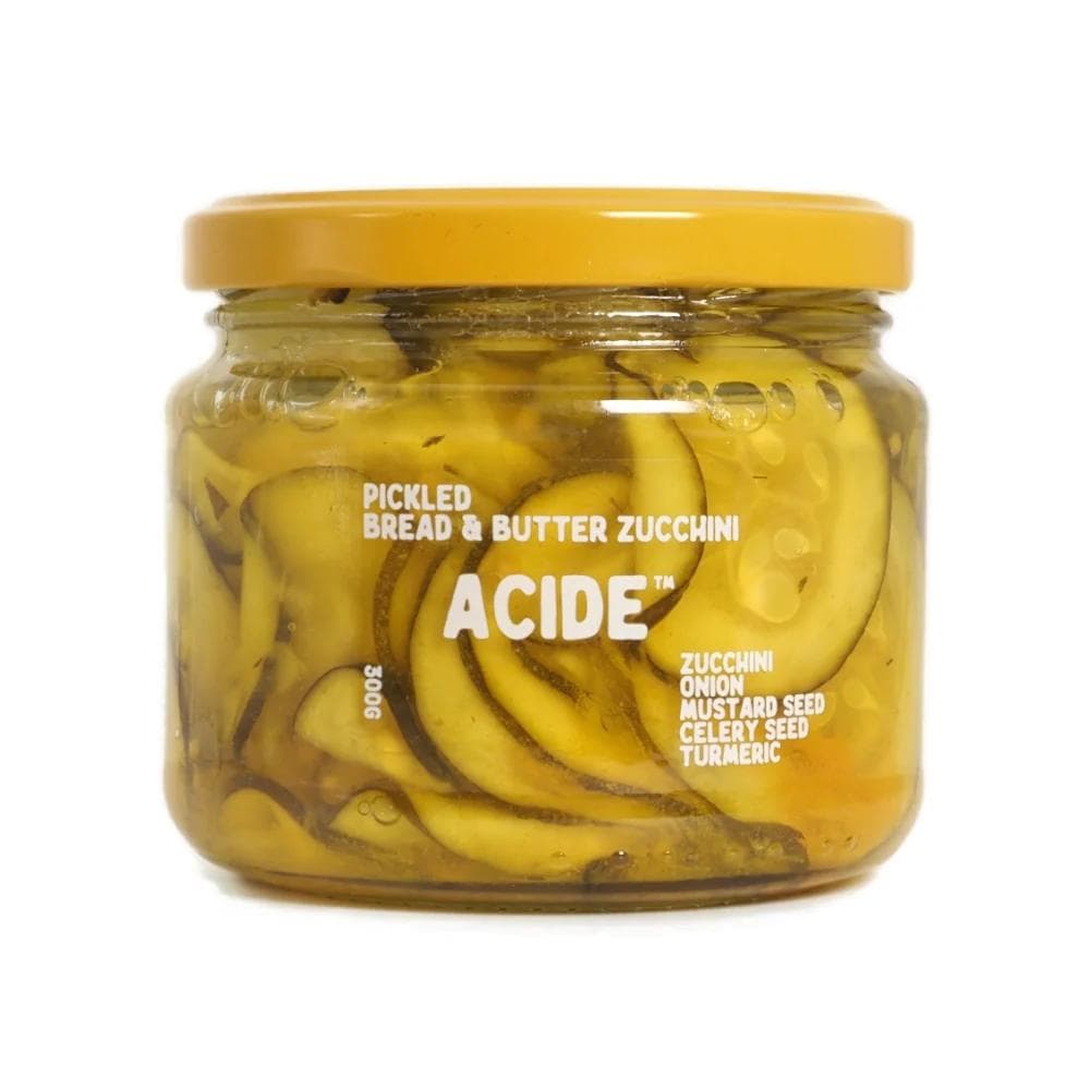 Jar of Acide pickled bread and butter zucchini with yellow lid