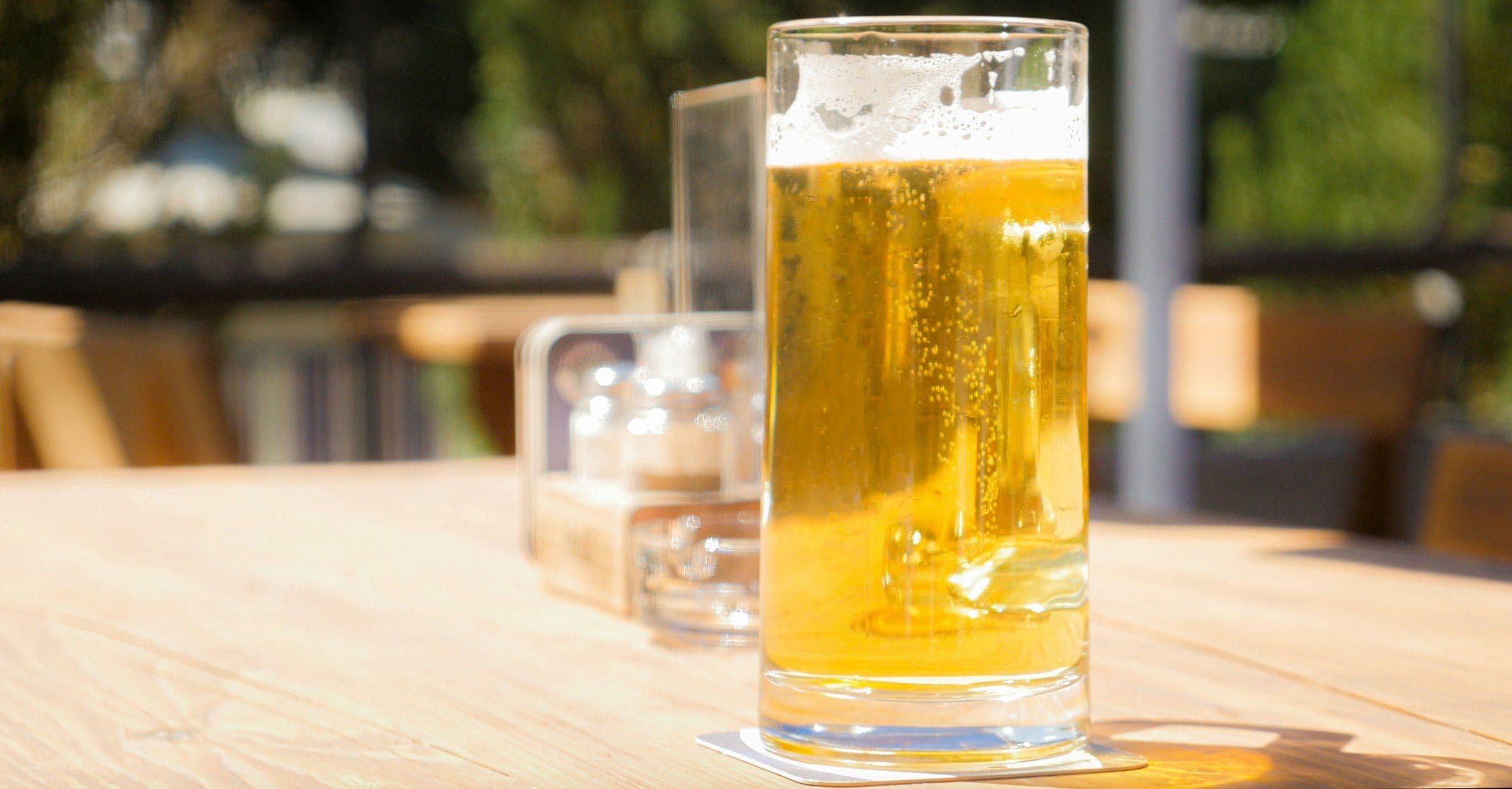 Glass of lager in a beer garden