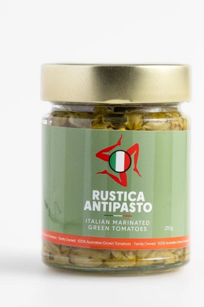 Jar of Rustica Antipasto marinated green tomatoes with gold lid
