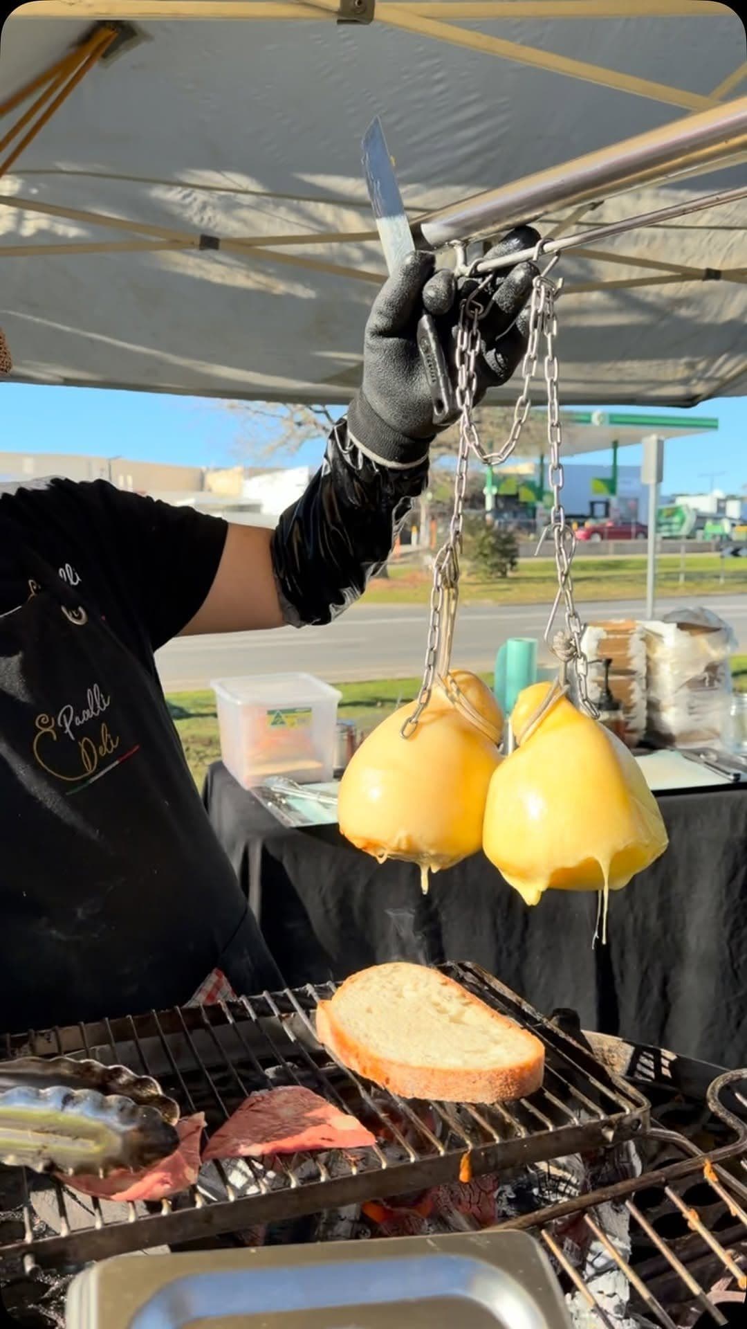 Caciocavallo cheese hanging over the grill at Pacelli Deli