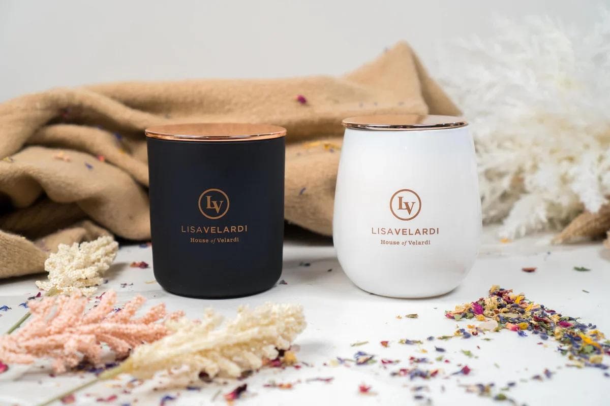 Black and white Lisa Velardi candles with dried flowers