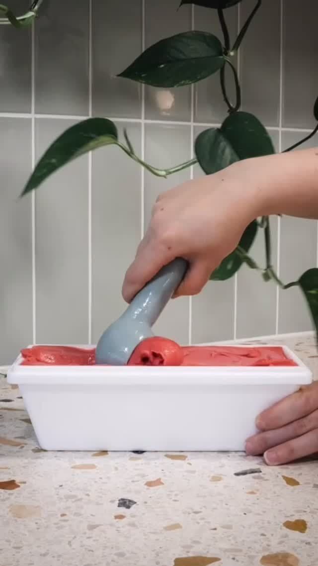 Raspberry sorbet being scooped at Boca Gelato