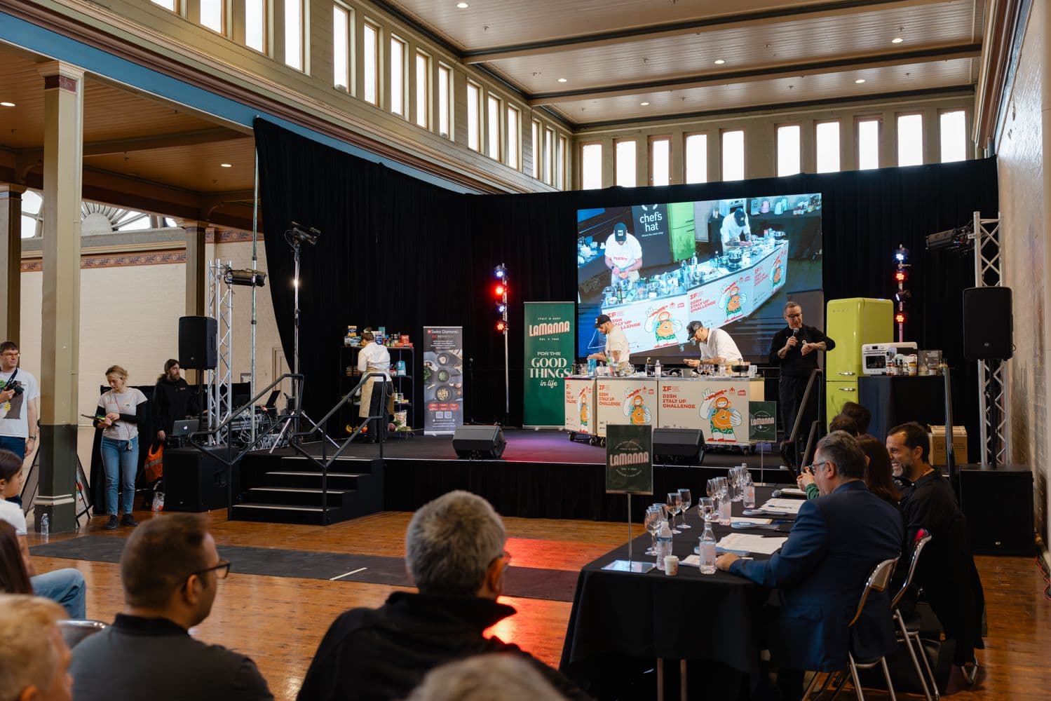 A guest chef cooking live on stage
