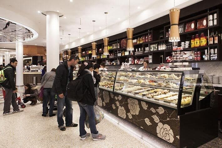 Inside Brunetti Classico on Lygon Street, with its long pastry counter