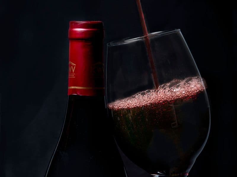 Red wine being poured into a glass