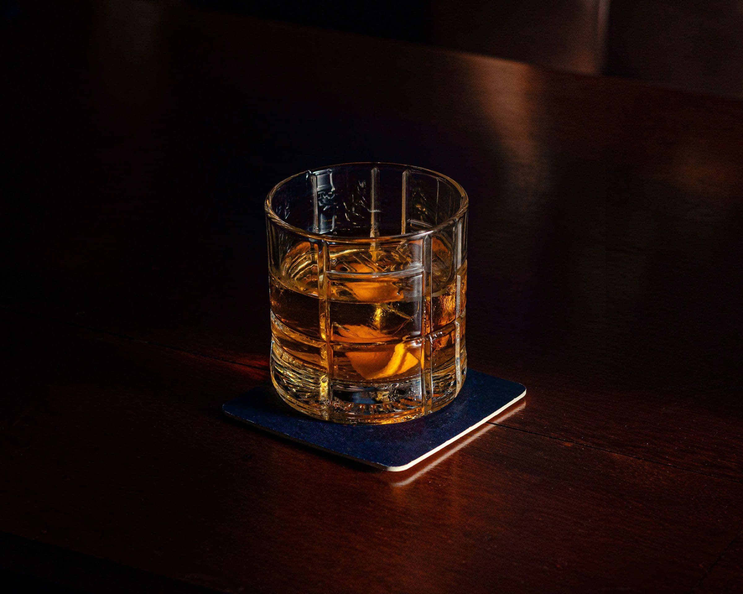 Glass of whisky on a table