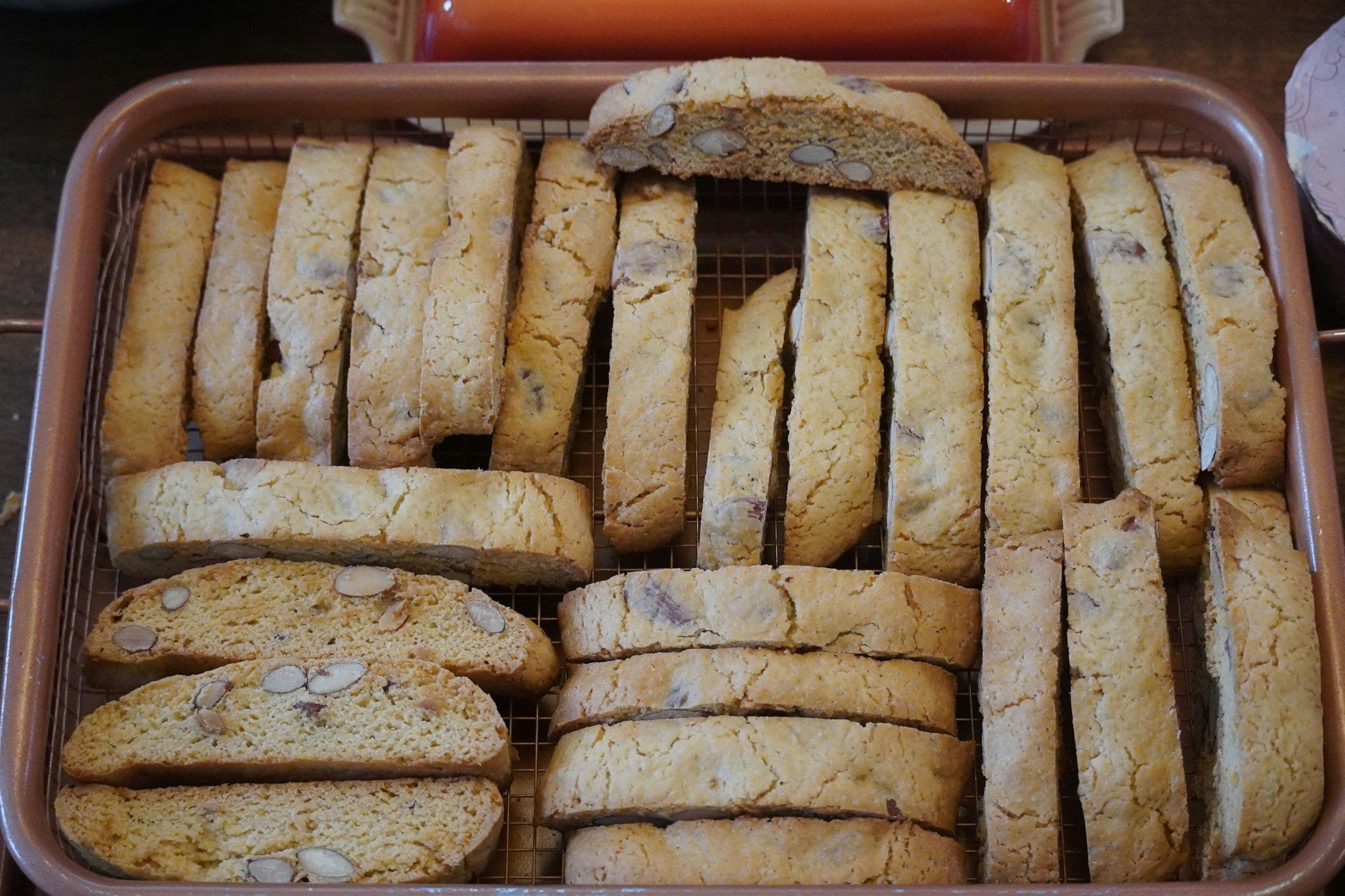 Tray of freshly baked almond biscotti with nuts