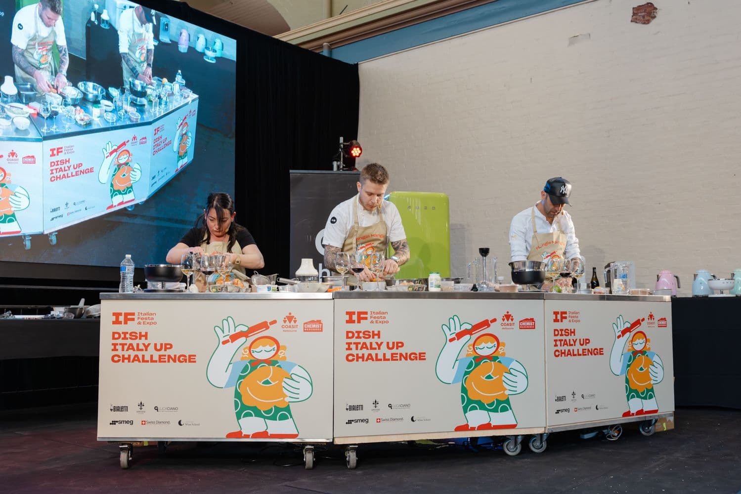 Three chefs compete in Italian Festa Dish Italy Up Challenge cooking competition on stage
